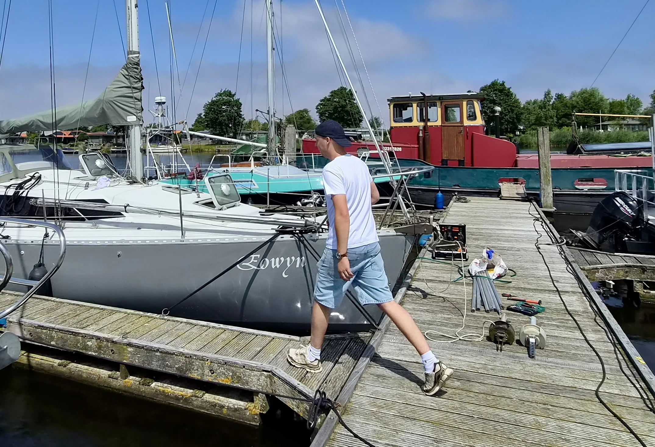 Preparing a sailboat at the marina